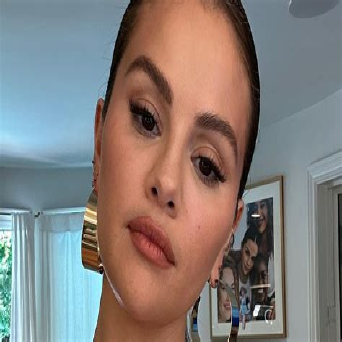 Selena Gomez goes nude under just a towel as she enjoys breakfast in bed in candid new photo